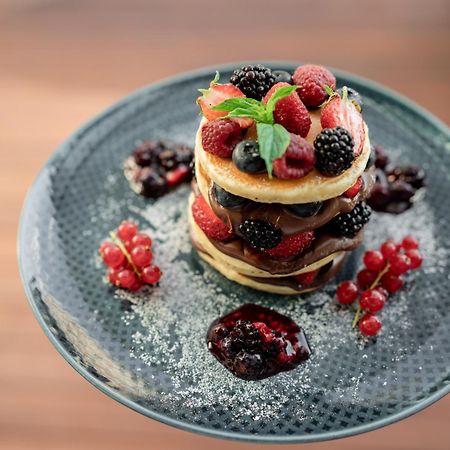 Address Istanbul Hotel Exterior photo A stack of pancakes with fruit