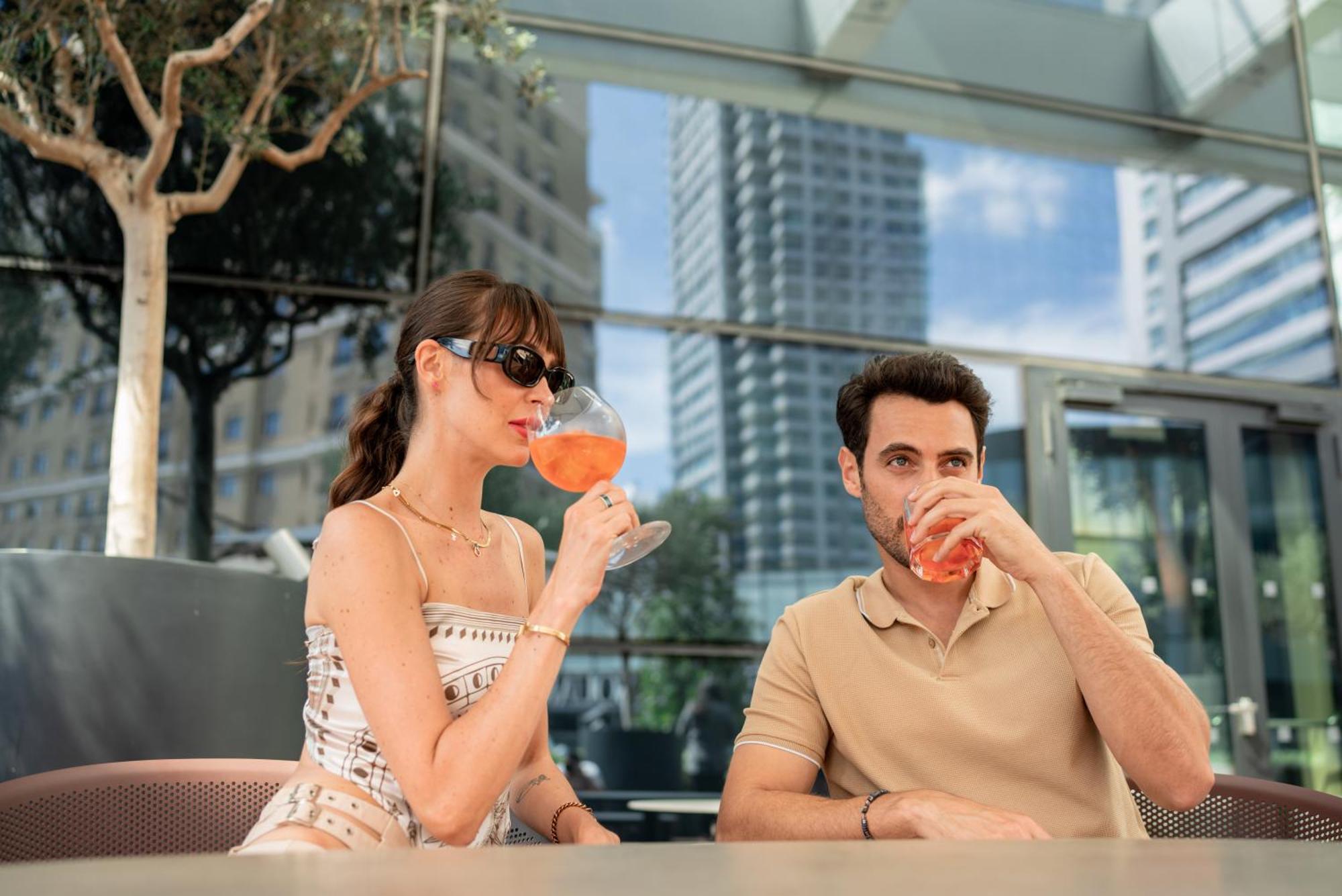 Address Istanbul Hotel Exterior photo A couple drinking Aperol Spritz